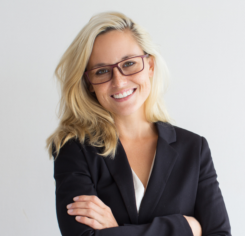 smiling woman with blonde hair wearing glasses